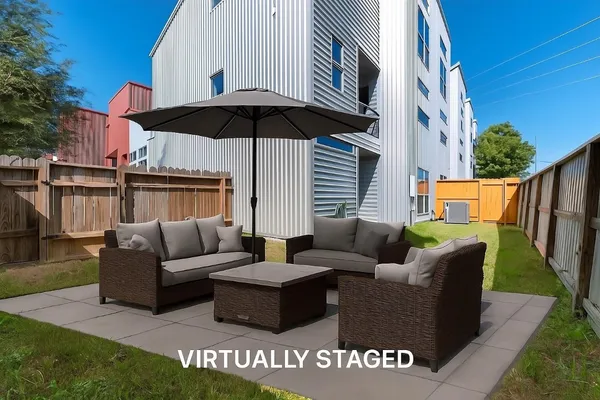 a view of a patio with couches and potted plants
