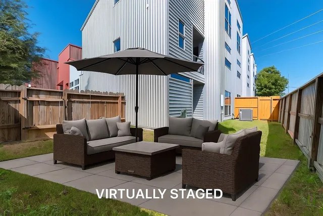 a view of a patio with couches and potted plants