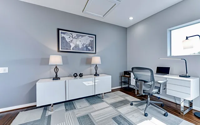 a room with a chair and gym equipment