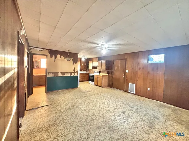 a bathroom with a granite countertop sink a toilet and shower