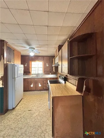 a view of a hallway with a chandelier