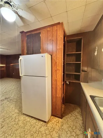 a view of an empty room with a bathroom