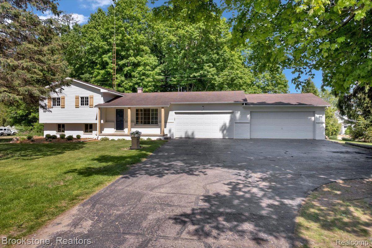 3265 Baldwin Road Metamora, MI 48455 - Photo 2 of 46 4 car garage & wide driveway w/parking pad