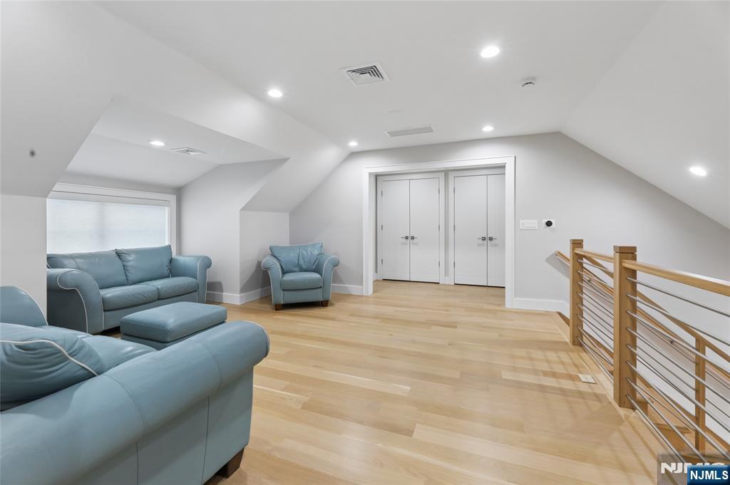 31 Engleside Street Cresskill, NJ 07626 - Photo 25 of 49 a living room with furniture and a wooden floor
