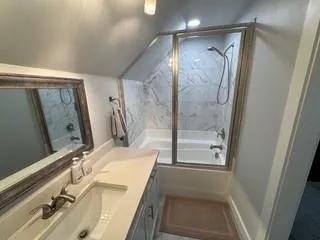a bathroom with a sink and a mirror