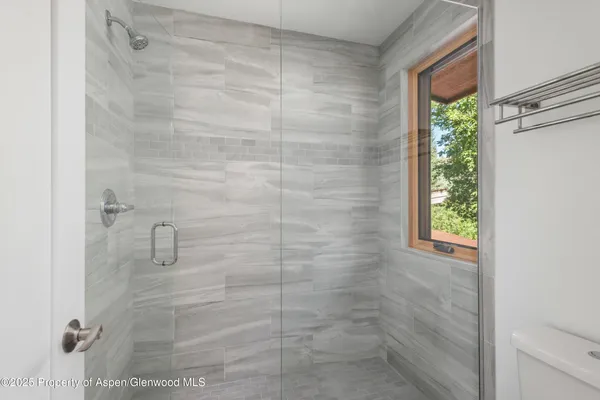 a aerial view of a house with pool and garden