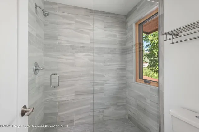 a aerial view of a house with pool and garden