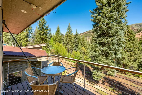 a view of a balcony with wooden floor