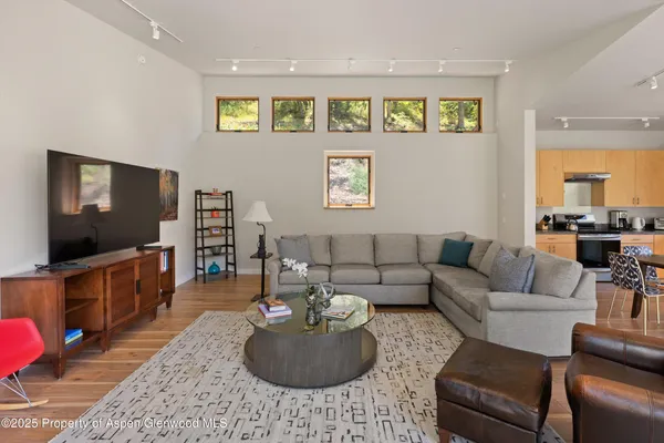 a view of a room that has a large window