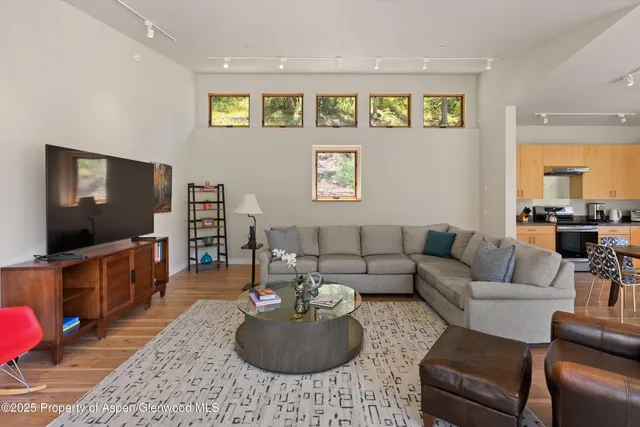 a view of a room that has a large window