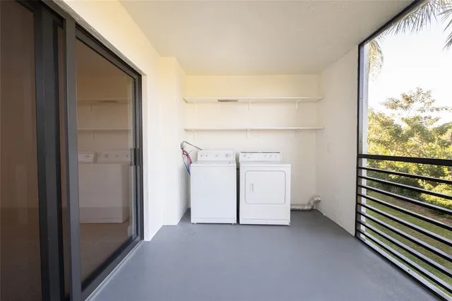 a view of a room that has a large window