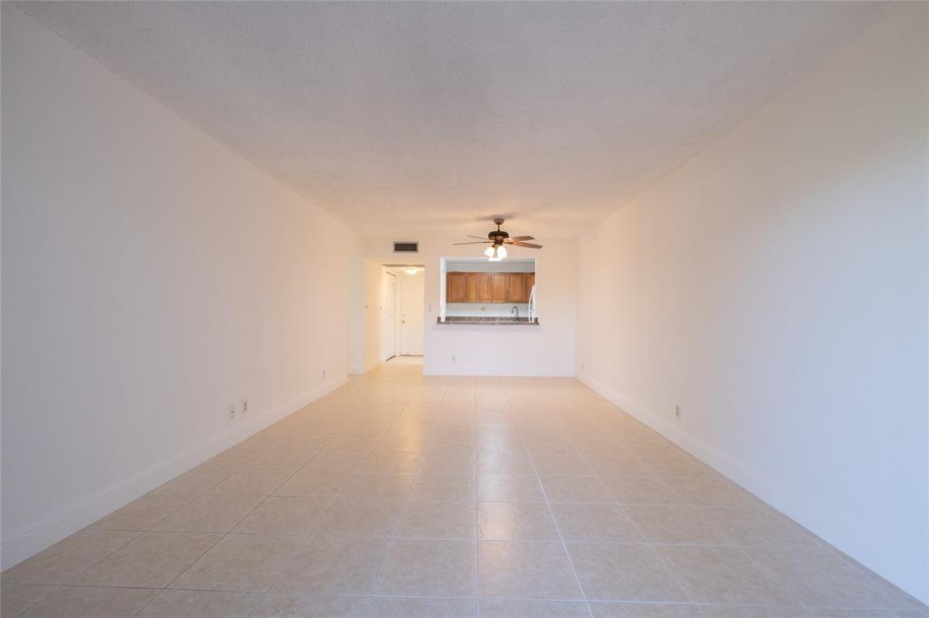 9233 Southwest 8th Street, Unit 222 Boca Raton, FL 33428 - Photo 13 of 29 a view of a room with a kitchen