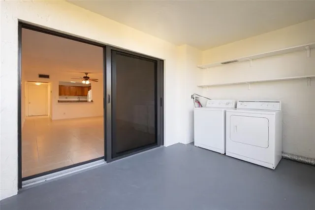 a view of a storage & utility room with washer and dryer