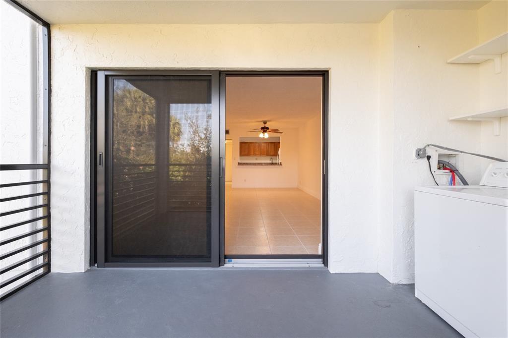 9233 Southwest 8th Street, Unit 222 Boca Raton, FL 33428 - Photo 10 of 29 a view of a hallway with closet and wooden floor