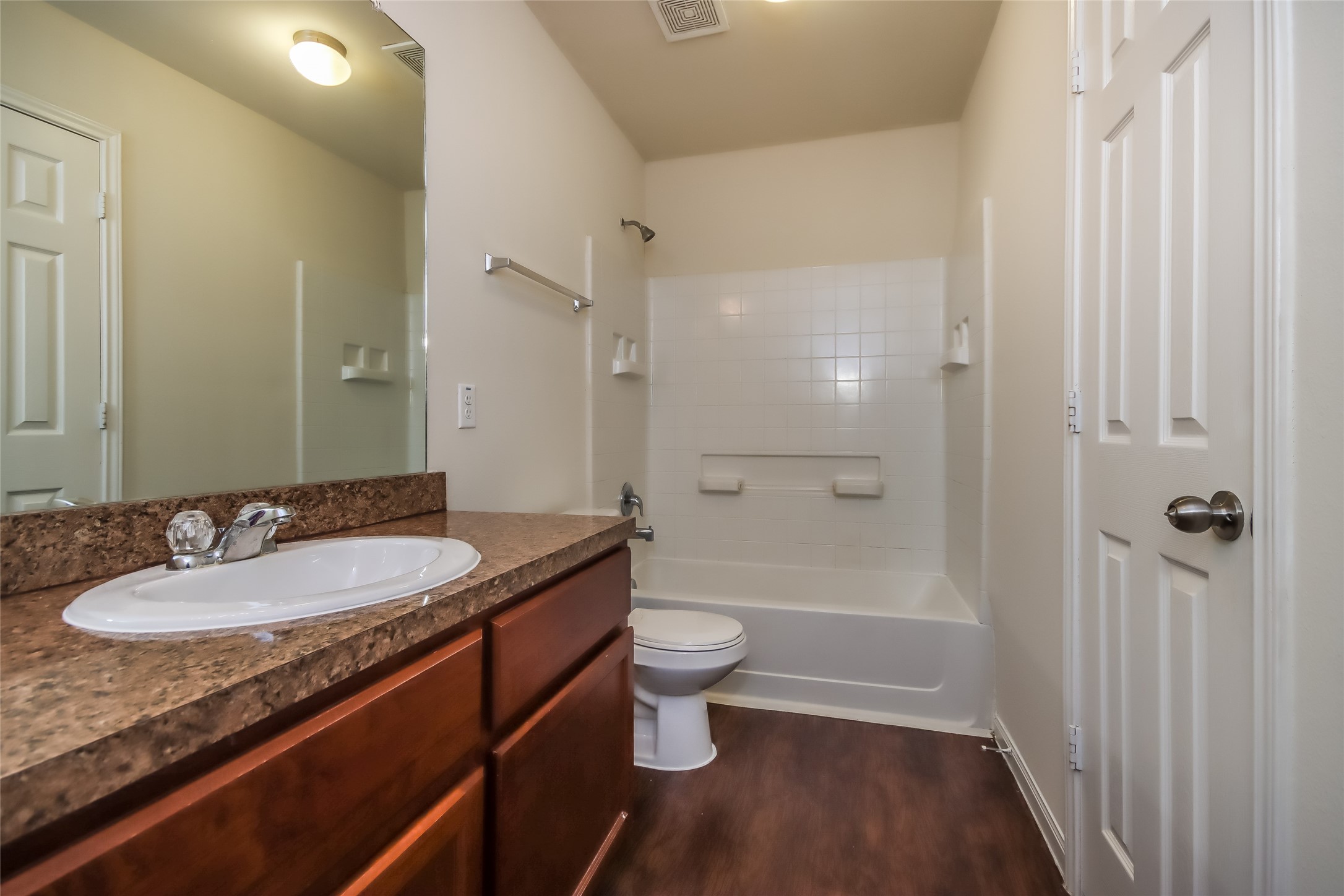 13022 Ristina Circle Houston, TX 77048 - Photo 15 of 15 a bathroom with a granite countertop sink a toilet a mirror and shower