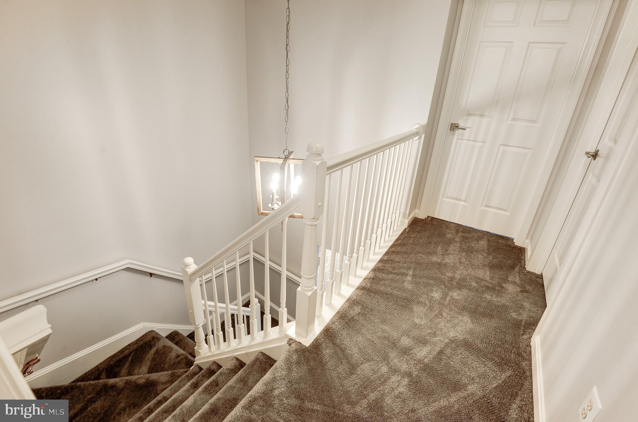11407 Gate Hill Place, Unit 112 Reston, VA 20194 - Photo 15 of 28 a view of an entryway with wooden floor