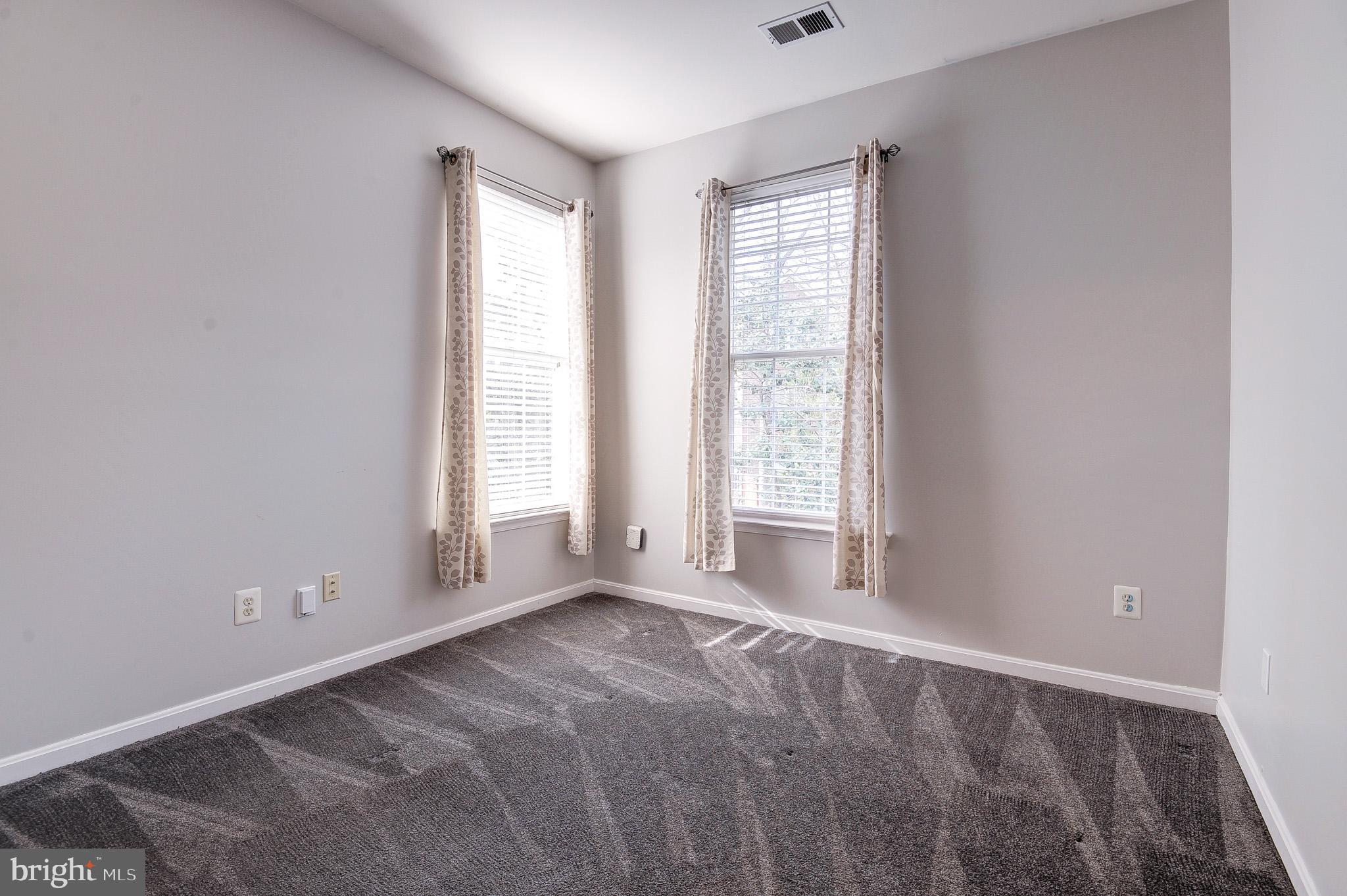 11407 Gate Hill Place, Unit 112 Reston, VA 20194 - Photo 16 of 28 a view of an empty room with a window