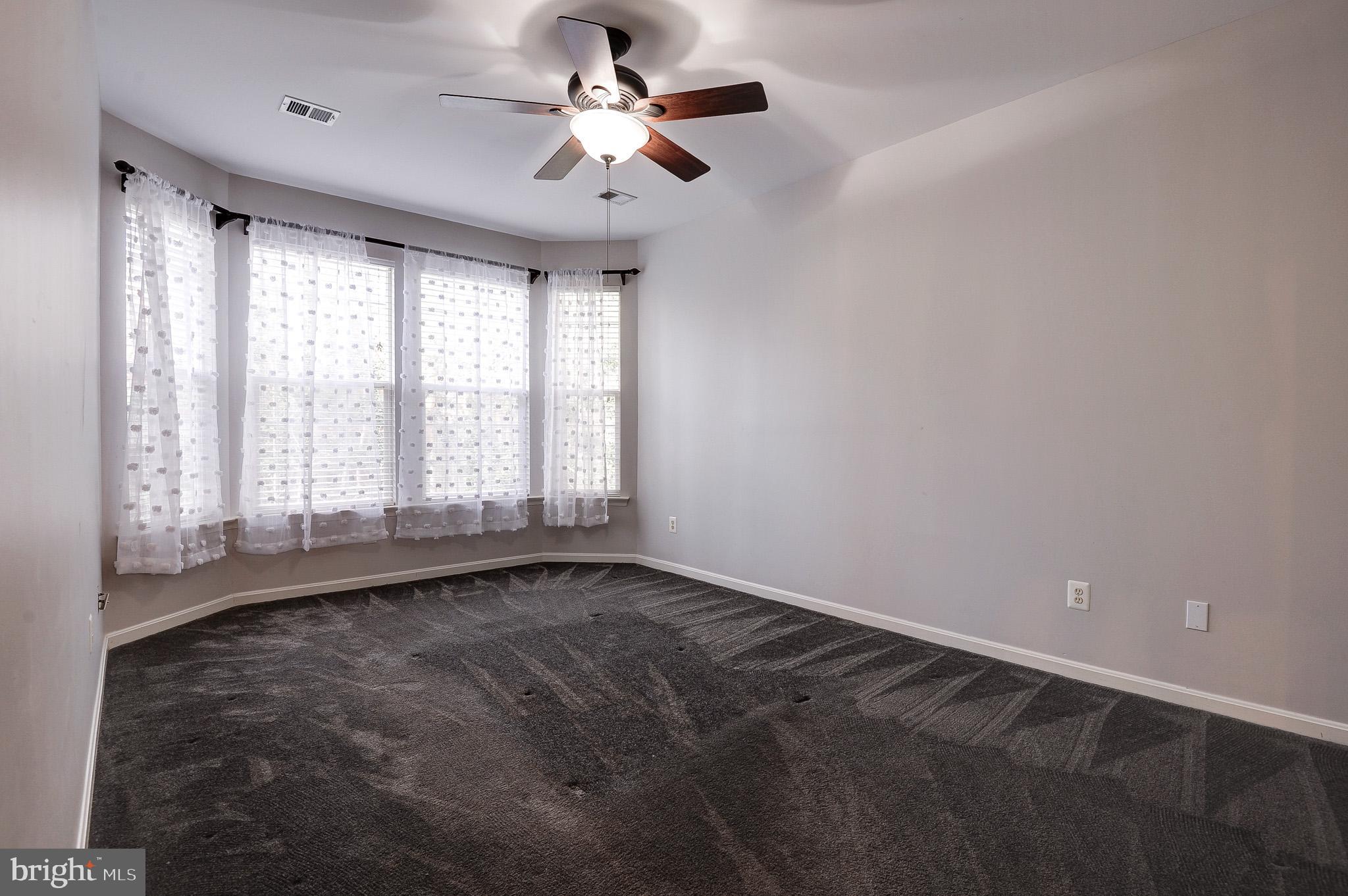 11407 Gate Hill Place, Unit 112 Reston, VA 20194 - Photo 18 of 28 a view of an empty room with a window