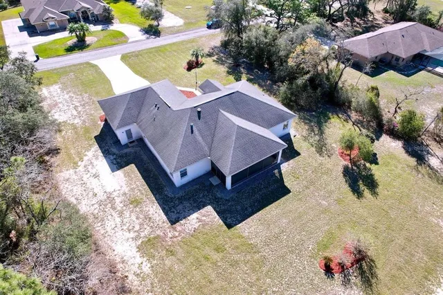 a view of a small yard with chairs