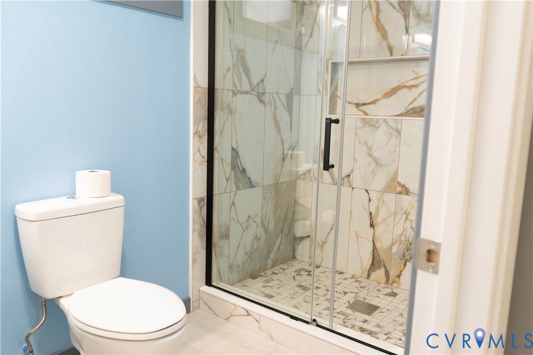 4060 Norborne Road Richmond, VA 23234 - Photo 12 of 24 Full bathroom with a marble finish shower and toil