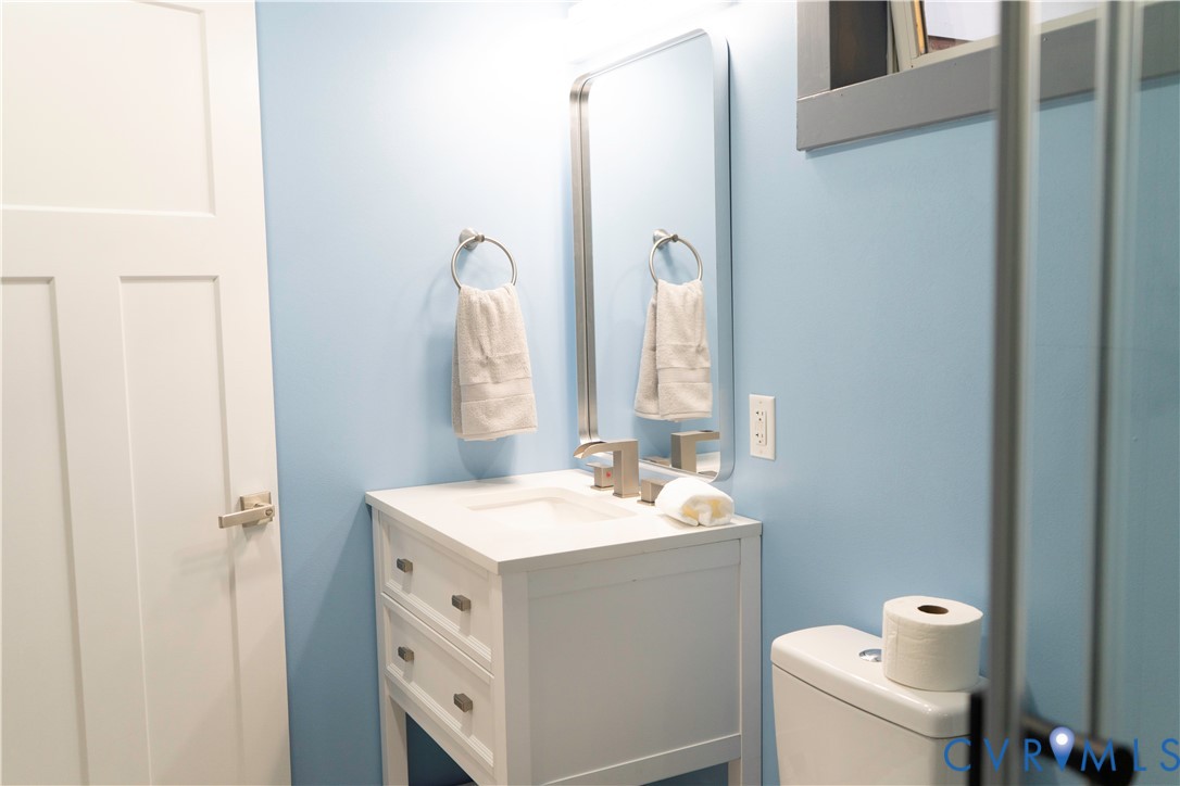 4060 Norborne Road Richmond, VA 23234 - Photo 13 of 24 First primary bedroom full bathroom with vanity an