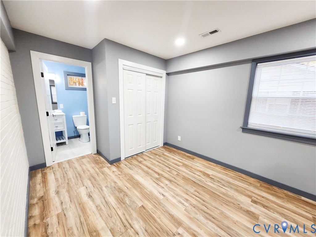 4060 Norborne Road Richmond, VA 23234 - Photo 9 of 24 Unfurnished bedroom featuring light wood-style flo