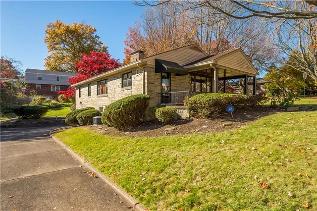 a front view of a house with garden