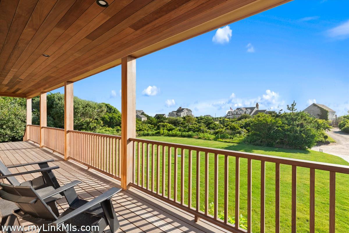 3 Tautemo Way Nantucket, MA 02554 - Photo 31 of 57 a view of balcony with wooden floor and outdoor seating