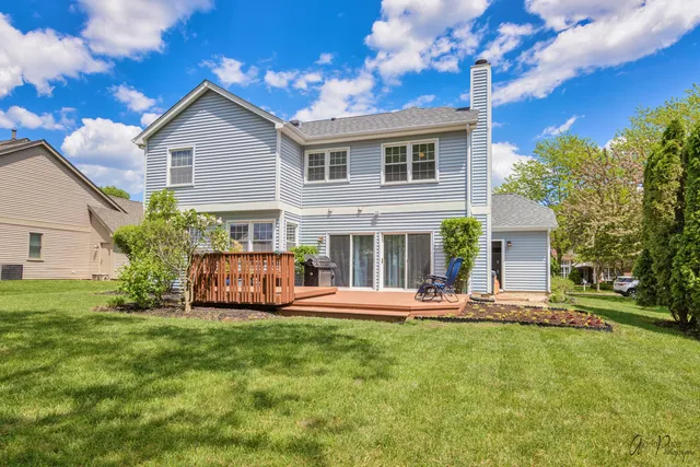 a front view of house with yard and outdoor seating