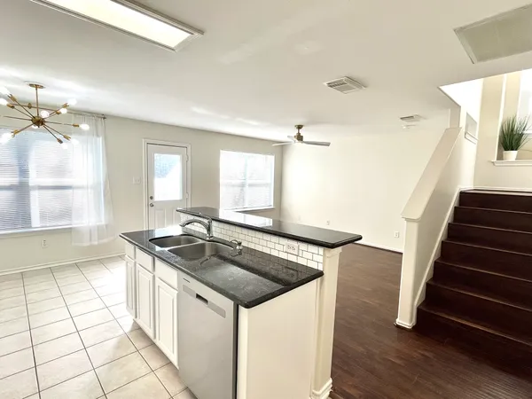 a kitchen with sink and window