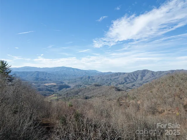 a view of mountain with field