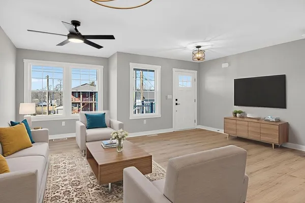 a living room with furniture and a flat screen tv