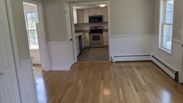 a view of a kitchen from the hallway with a hallway