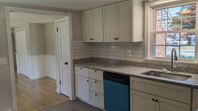 a kitchen with a sink and cabinets