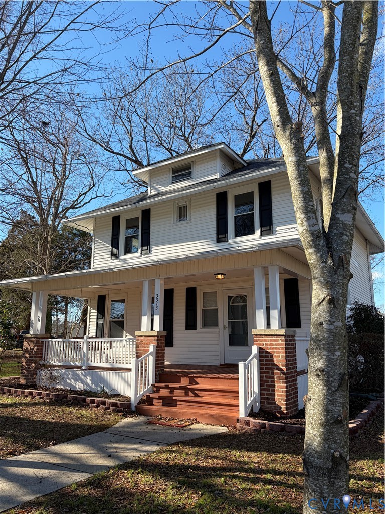 Traditional style home featuring a porch