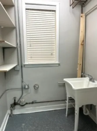 a bathroom with a sink and a window