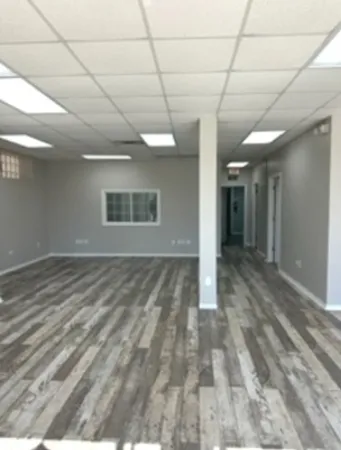 a view of a hallway with a white walls