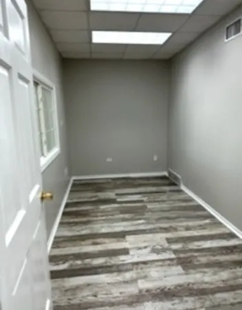 a view of a room with stairs and a window