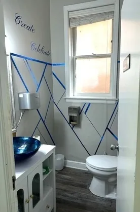a bathroom with a toilet a sink and a window