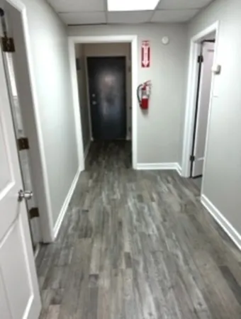 an entryway door with a hallway