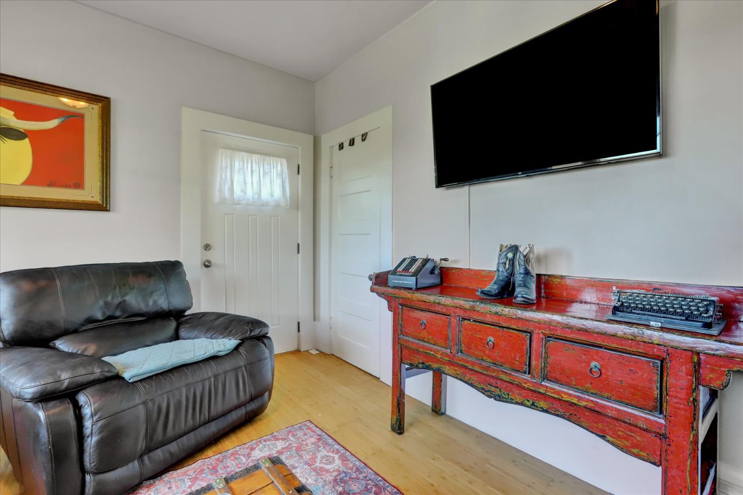 12562 Rough And Ready Highway Grass Valley, CA 95945 - Photo 15 of 99 a living room with furniture and a flat screen tv