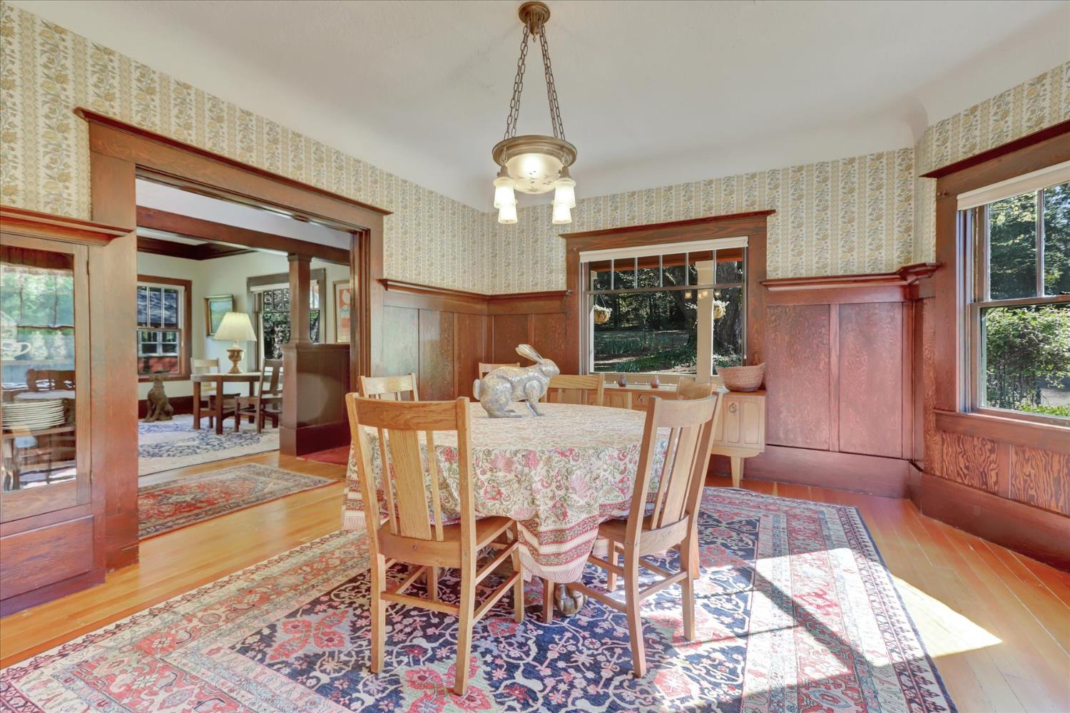 12562 Rough And Ready Highway Grass Valley, CA 95945 - Photo 24 of 99 a view of a dining room with furniture window and wooden floor