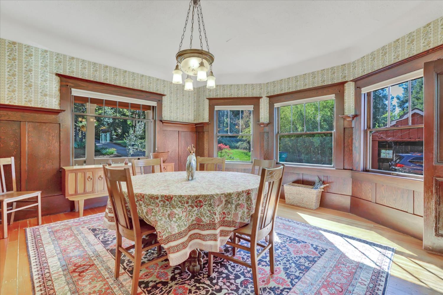 12562 Rough And Ready Highway Grass Valley, CA 95945 - Photo 25 of 99 a view of a dining room with furniture a livingroom and chandelier