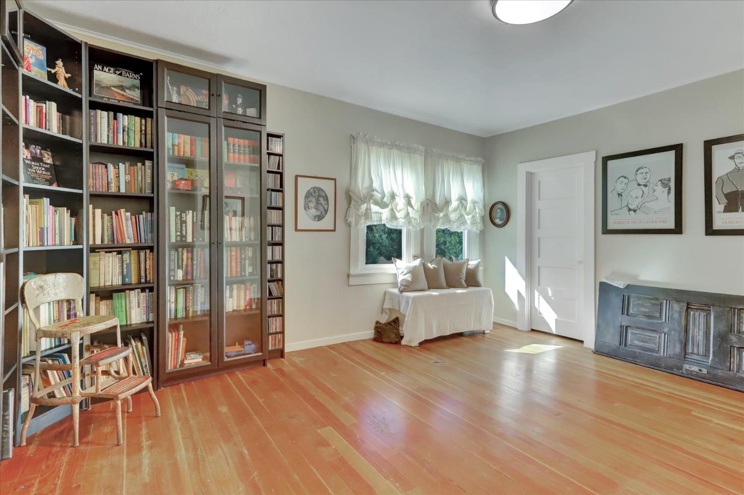 12562 Rough And Ready Highway Grass Valley, CA 95945 - Photo 34 of 99 a living room with furniture and a book shelf