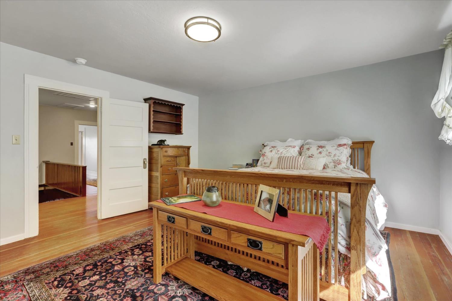 12562 Rough And Ready Highway Grass Valley, CA 95945 - Photo 40 of 99 a bed room with a bed and a chair