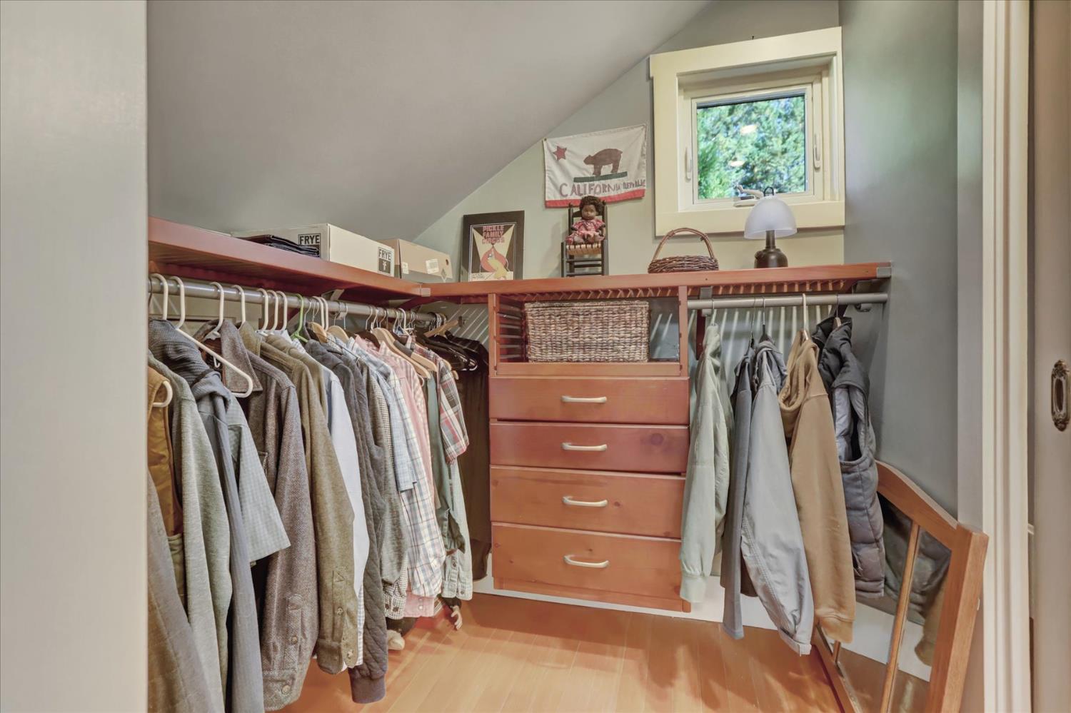 12562 Rough And Ready Highway Grass Valley, CA 95945 - Photo 46 of 99 a view of walk in closet with clothes and shoes
