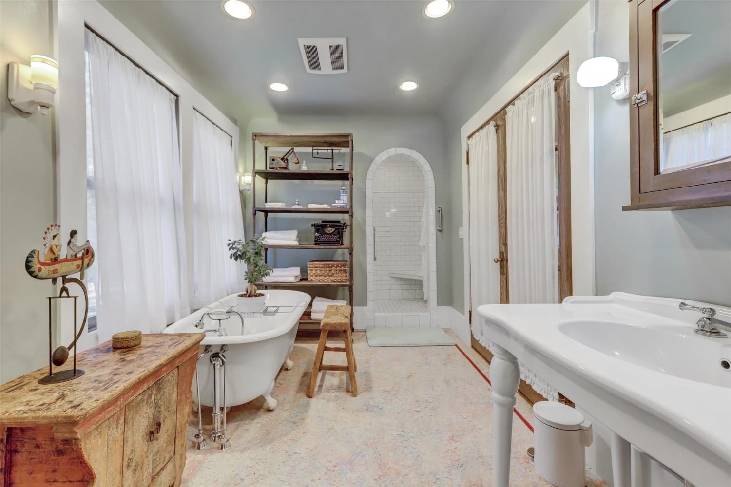 12562 Rough And Ready Highway Grass Valley, CA 95945 - Photo 47 of 99 a spacious bathroom with a granite countertop sink a toilet and a mirror