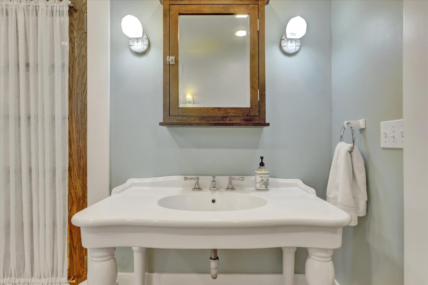 12562 Rough And Ready Highway Grass Valley, CA 95945 - Photo 48 of 99 a bathroom with a sink and mirror