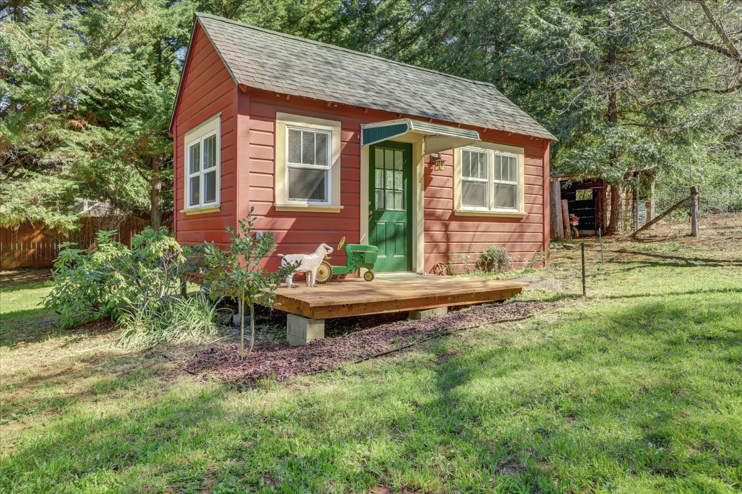 12562 Rough And Ready Highway Grass Valley, CA 95945 - Photo 62 of 99 a backyard of a house with table and chairs