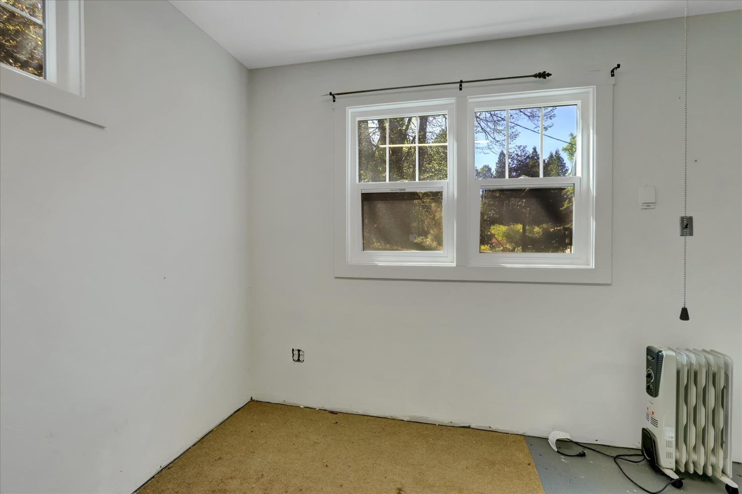 12562 Rough And Ready Highway Grass Valley, CA 95945 - Photo 77 of 99 a view of room with window and closet